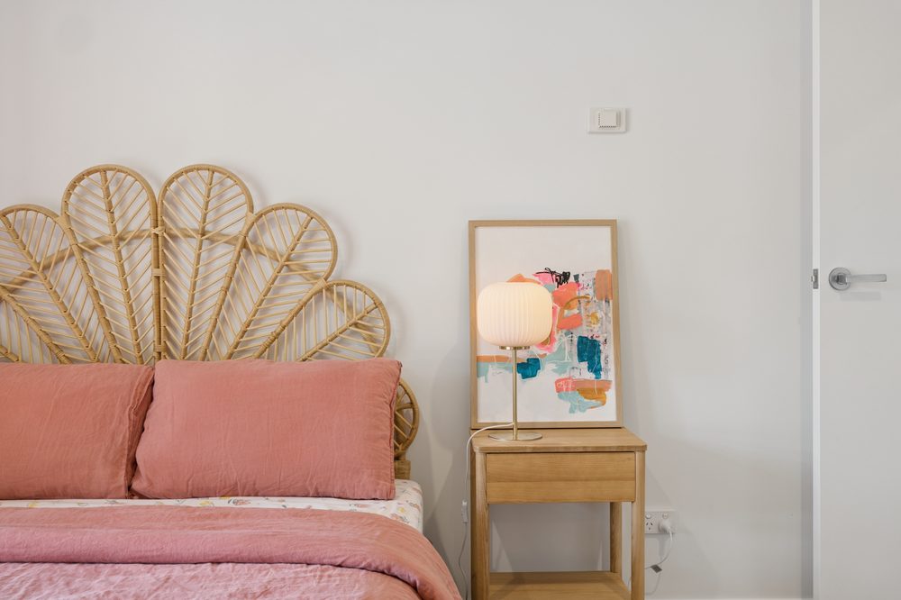 Bedroom detail with a rattan bedhead