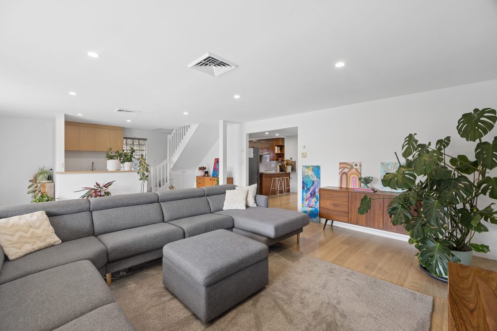 Living room with sectional sofa and plants